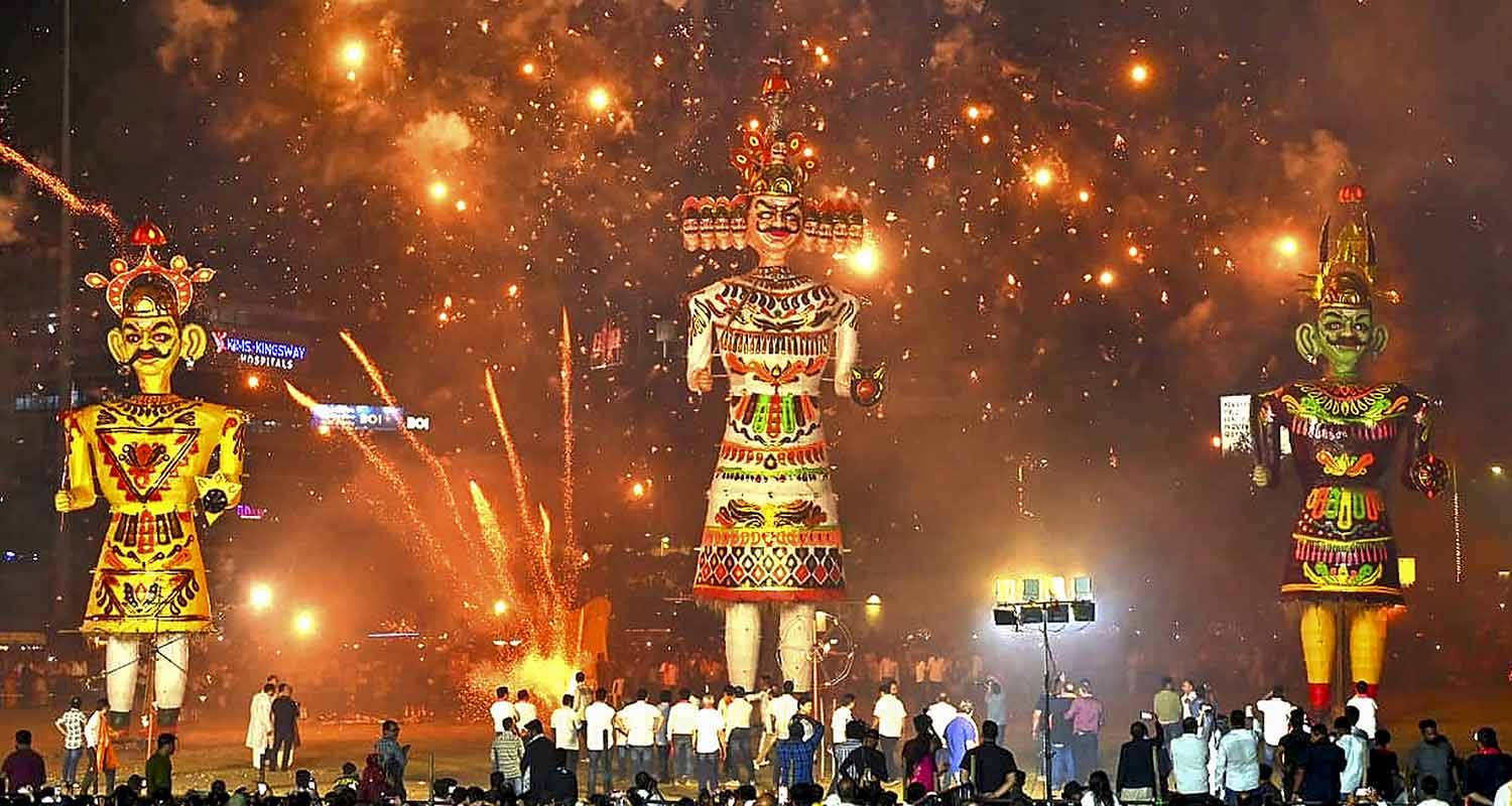 Nagpur: Fireworks explode behind effigies of demon king 'Ravana', his brother 'Kumbhakarna' and son 'Meghnath' during the ‘Dussehra’ festival celebration, in Nagpur, Maharashtra, Thursday, Oct. 2, 2025. (PTI Photo) (PTI10_02_2025_000638A)